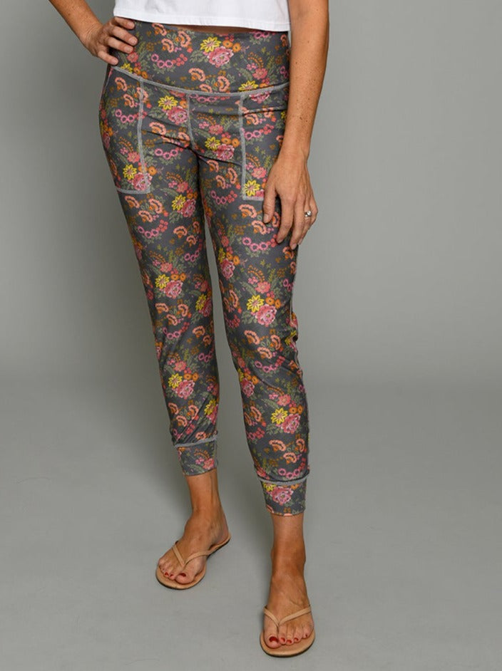 Flip Outfit Reversible Women’s Joggers, Pants - multicolor paisley floral print reverses to tonal pink mini gingham. Mid-rise sweat-wicking UPF 50. Made in the USA from recycled plastic bottles. Made by women for women. Front view of paisley floral side.